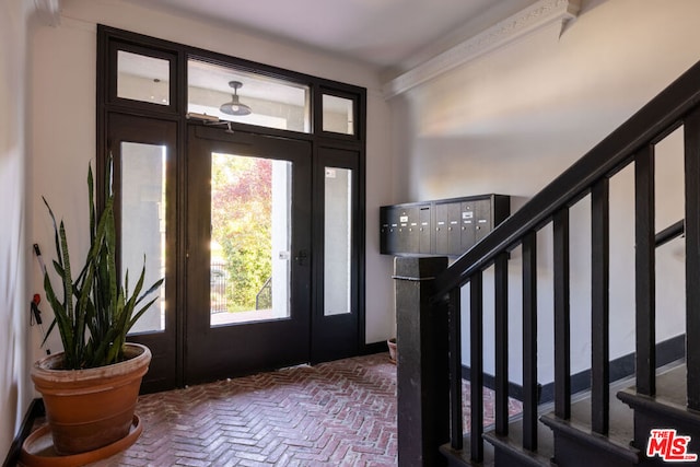 foyer with a mail area