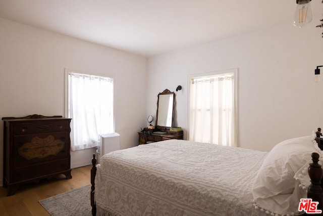 bedroom featuring light wood-type flooring