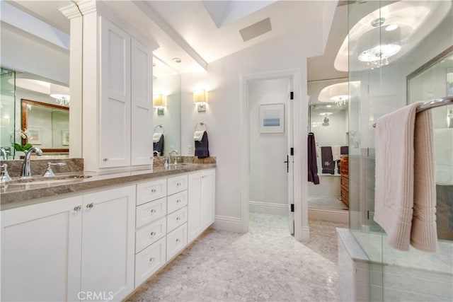 bathroom with tile patterned floors, vanity, a shower with shower door, and lofted ceiling