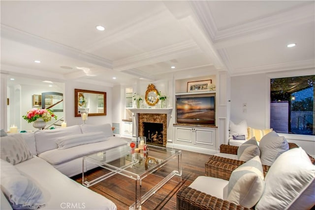 living room with coffered ceiling, crown molding, beam ceiling, a premium fireplace, and dark hardwood / wood-style floors