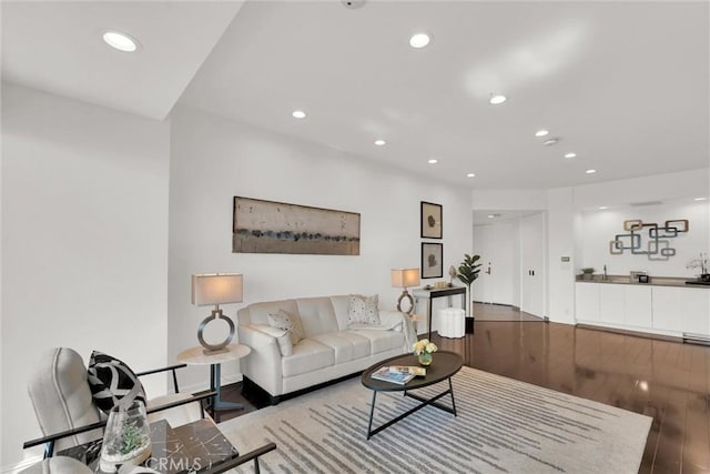 living room with wood finished floors and recessed lighting