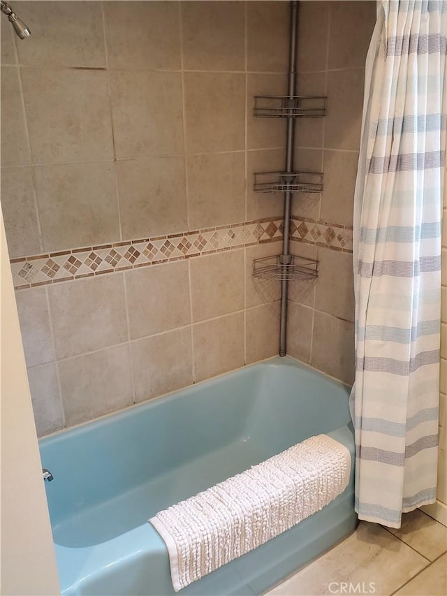 bathroom featuring tile patterned floors and shower / bath combo