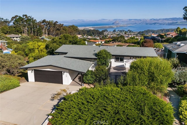 aerial view featuring a water and mountain view