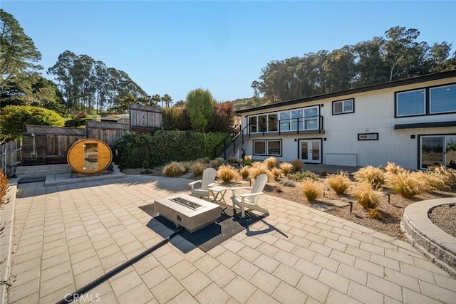 view of patio with an outdoor fire pit