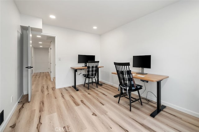 home office featuring light hardwood / wood-style floors