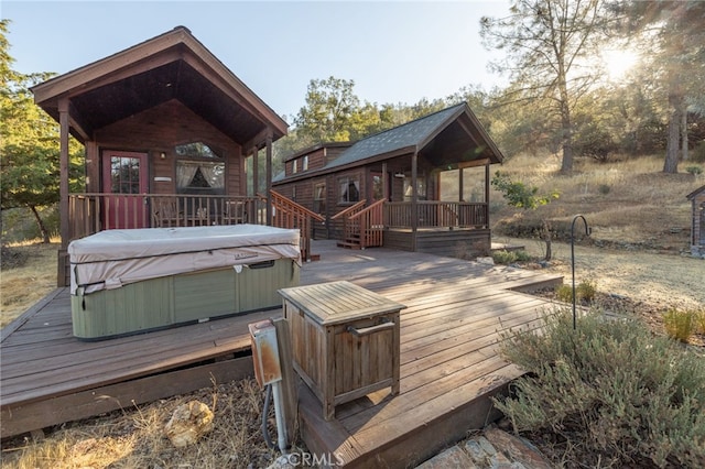 deck with a hot tub