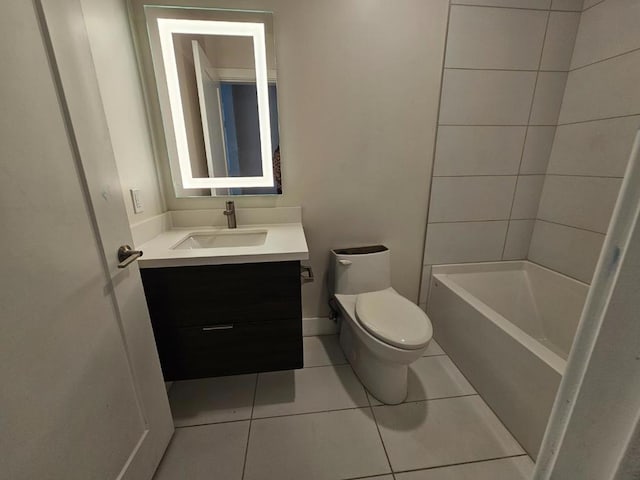 bathroom with vanity, toilet, and tile patterned floors