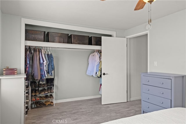 bedroom with hardwood / wood-style floors and ceiling fan