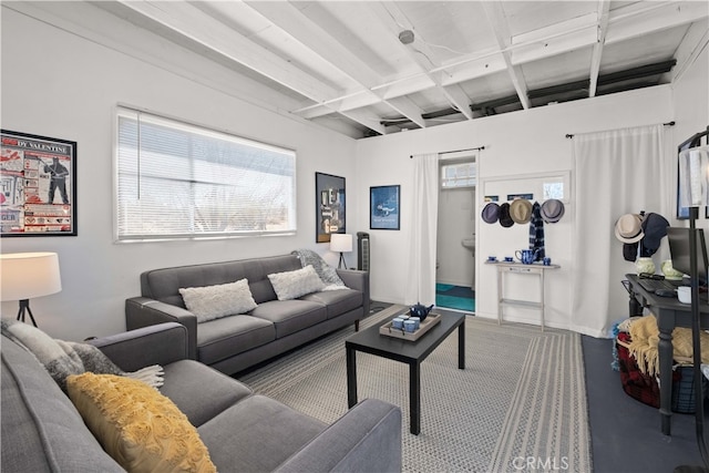 living room with beamed ceiling