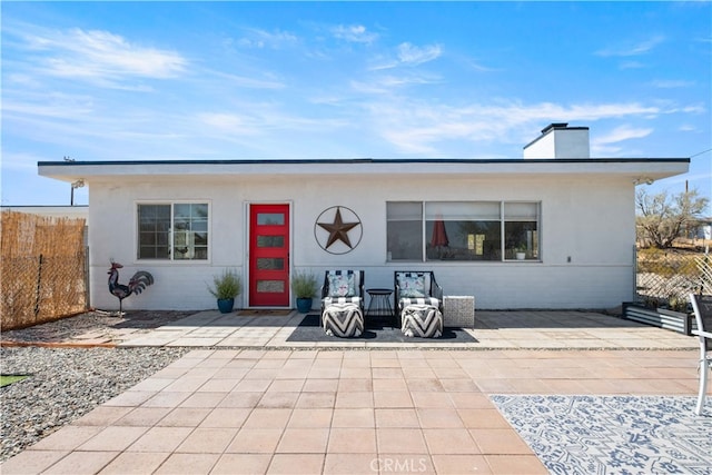 back of property with a patio area