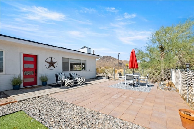 view of patio / terrace featuring a mountain view