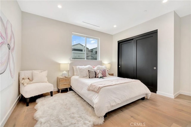 bedroom featuring light wood-type flooring