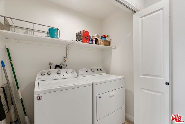 laundry area with separate washer and dryer