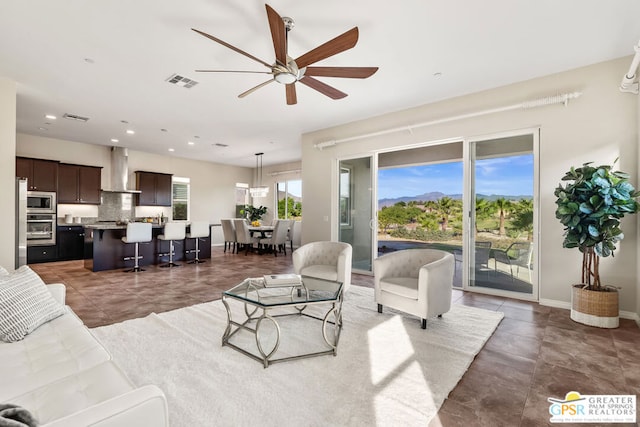 living room with ceiling fan