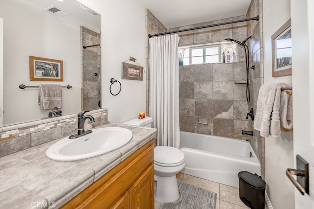 full bathroom featuring shower / bath combo, tile patterned floors, vanity, and toilet