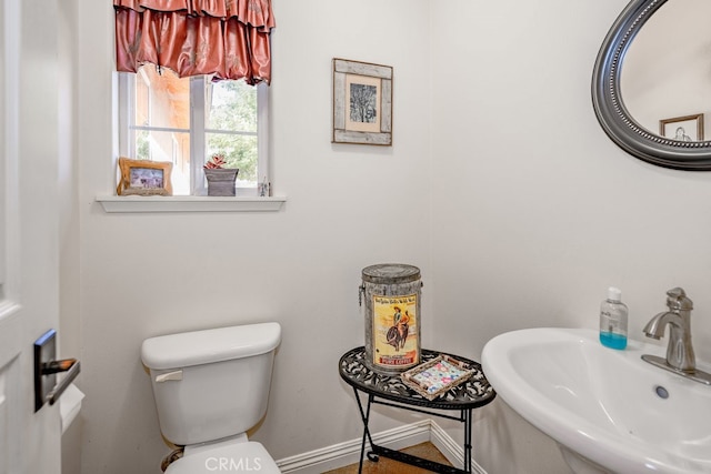 bathroom with sink and toilet