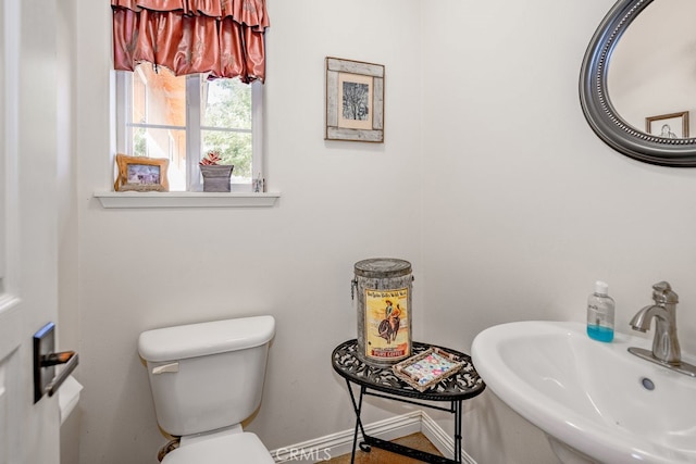 bathroom featuring sink and toilet