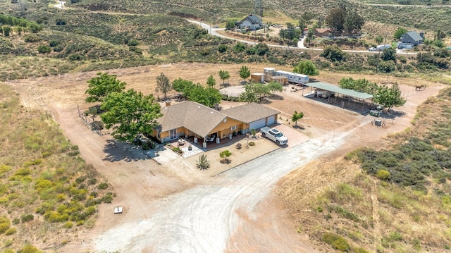 birds eye view of property with a rural view