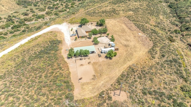 birds eye view of property with a rural view