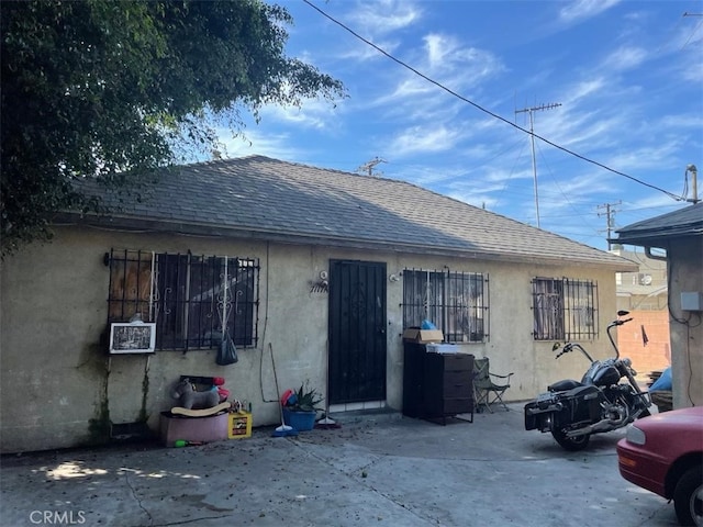 back of house with a patio