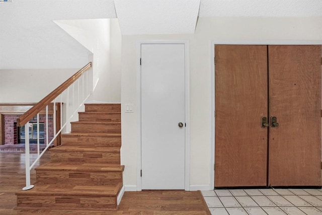 staircase featuring hardwood / wood-style flooring