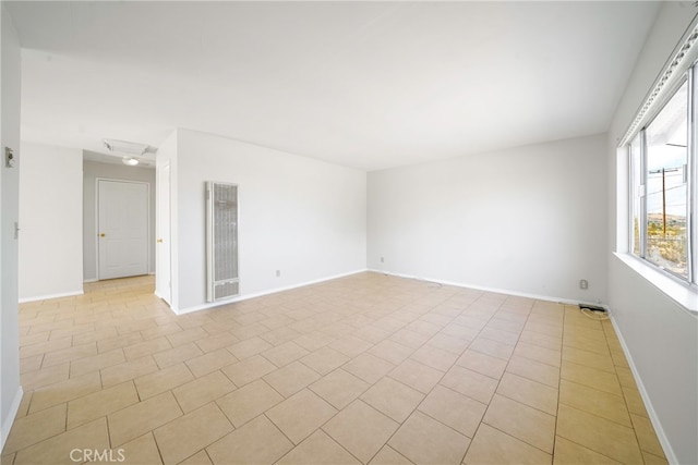 empty room featuring light tile patterned floors