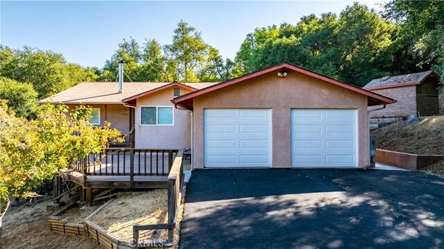 single story home featuring a garage