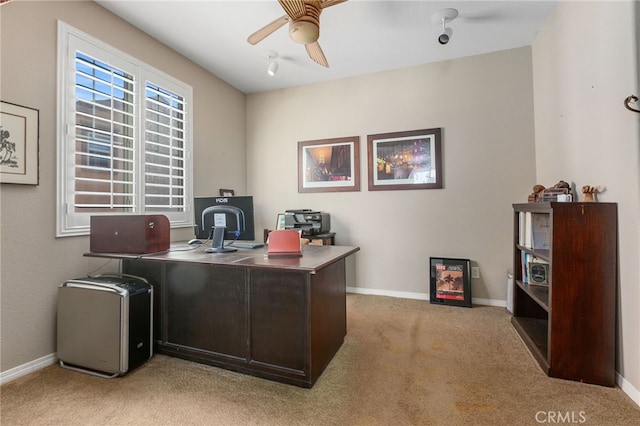 home office with ceiling fan and light colored carpet