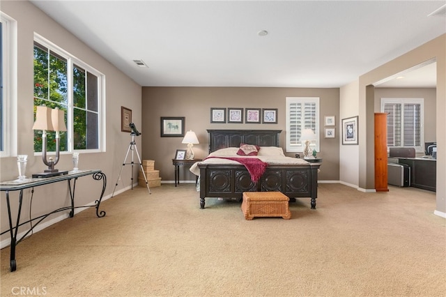 bedroom with light carpet