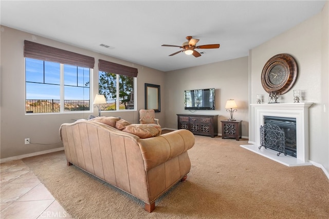 living room with ceiling fan and light tile patterned floors