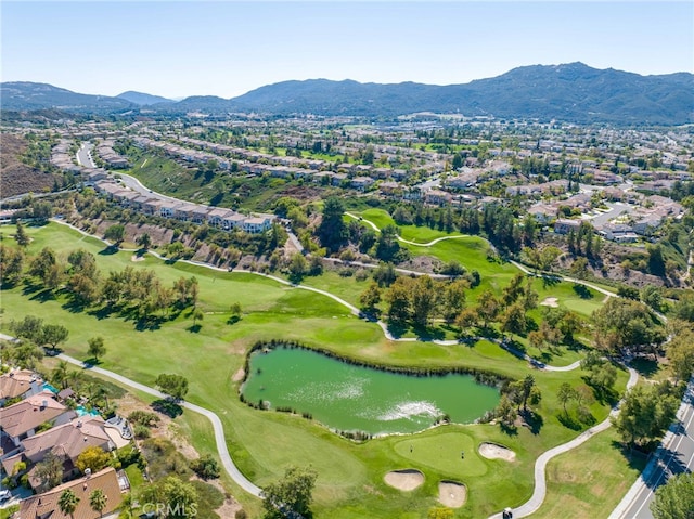 drone / aerial view featuring a water and mountain view