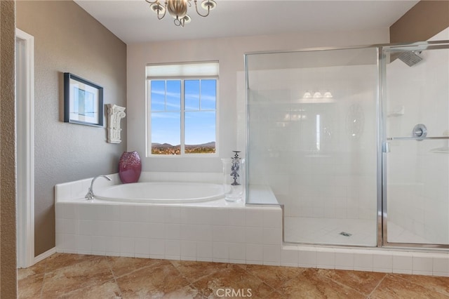 bathroom with shower with separate bathtub