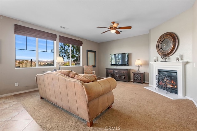 living room featuring ceiling fan and light tile patterned floors