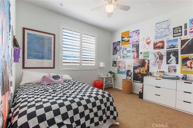 bedroom with ceiling fan and light colored carpet