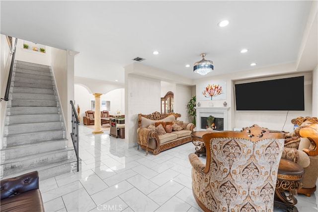 living room featuring decorative columns