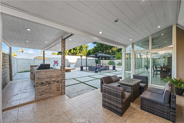 view of patio featuring a gazebo and a grill