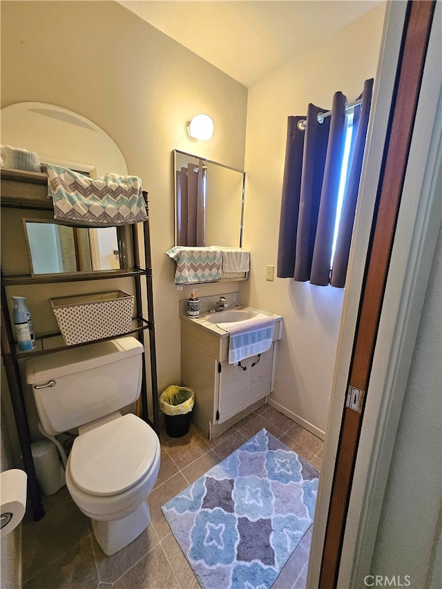 bathroom with tile patterned floors, vanity, and toilet