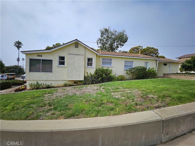 ranch-style home with a front yard