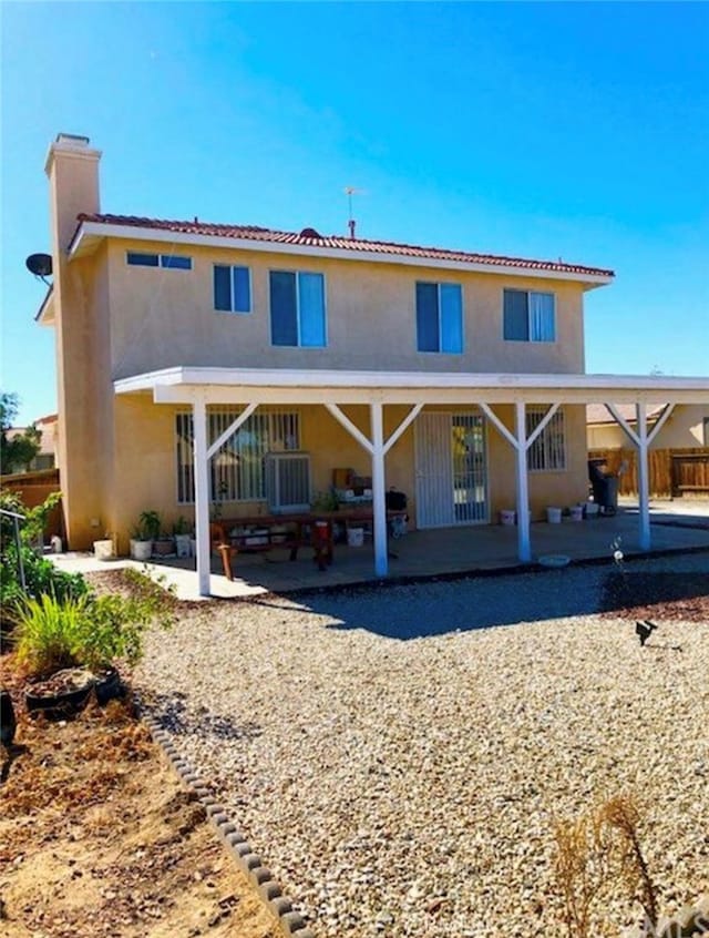 back of house featuring a patio area