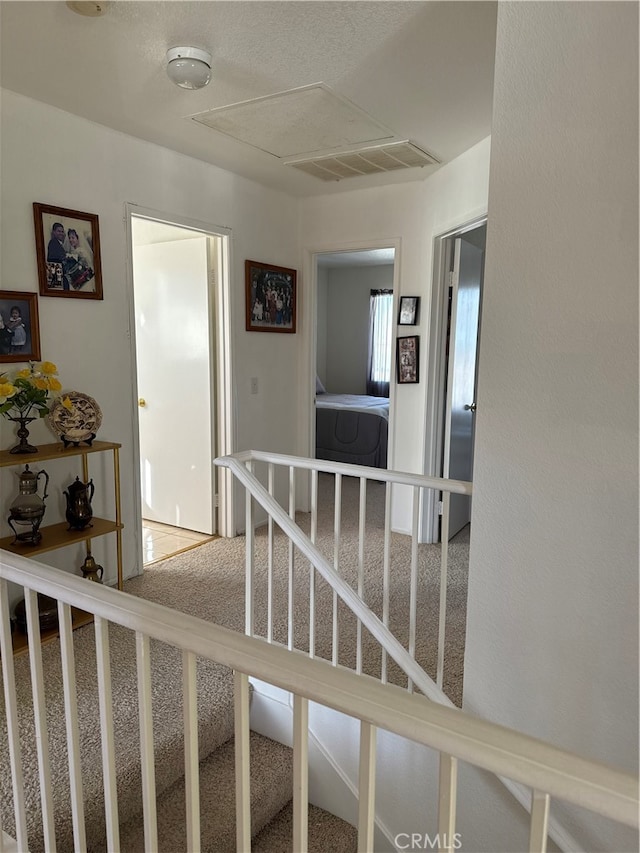 corridor with carpet flooring