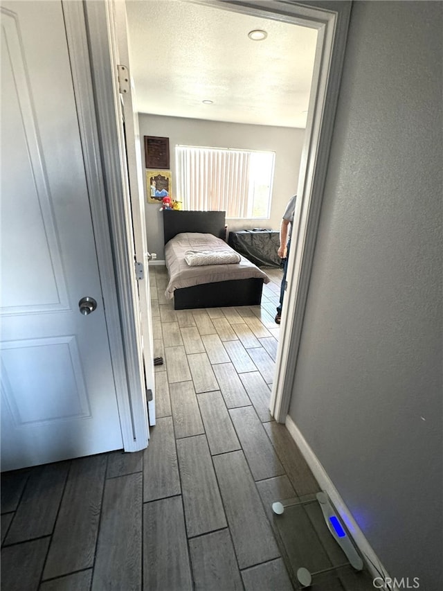 corridor with wood-type flooring