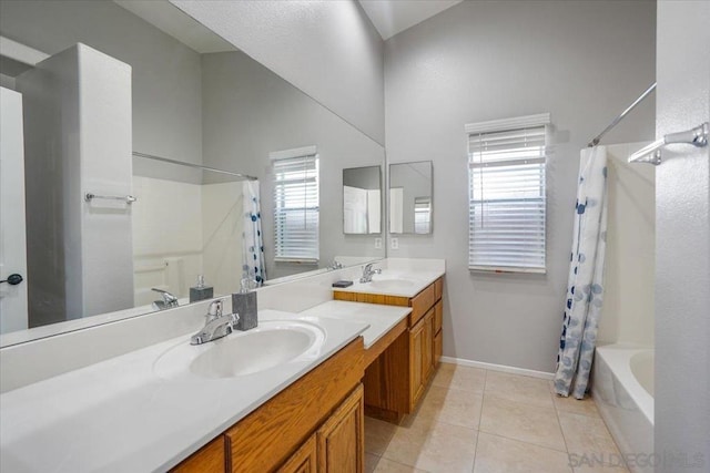 bathroom with a towering ceiling, shower / tub combo, tile patterned flooring, and vanity