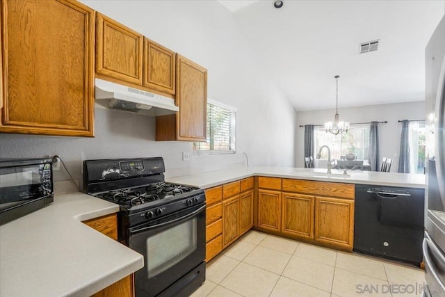 kitchen with a wealth of natural light, a chandelier, sink, and black appliances