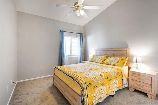 bedroom featuring ceiling fan, carpet floors, and vaulted ceiling