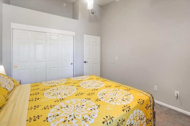 carpeted bedroom with a closet