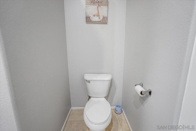 bathroom with tile patterned floors and toilet