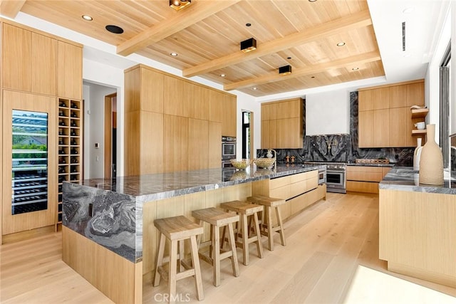 kitchen featuring dark stone countertops, wooden ceiling, beamed ceiling, and light hardwood / wood-style floors