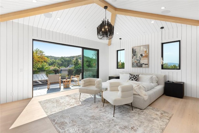 bedroom featuring an inviting chandelier, lofted ceiling with beams, access to outside, wooden walls, and light wood-type flooring