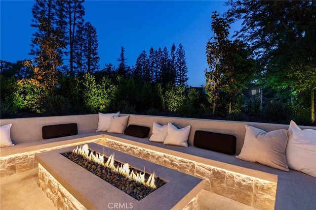 view of patio / terrace with an outdoor fire pit