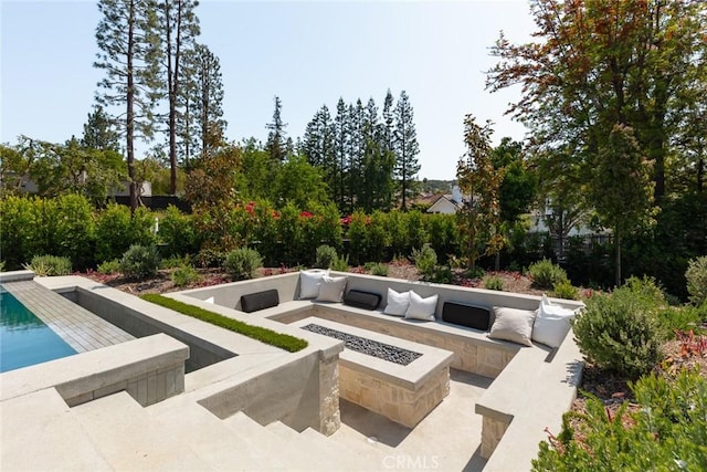 view of patio featuring an outdoor fire pit